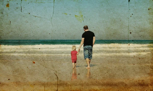 Father and daughter on the beach. Photo in old image style. — Stock Photo, Image