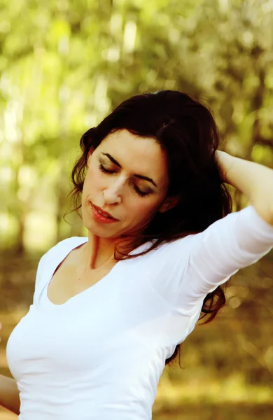 Portrait of beautiful 35 years old woman in summer forest — Stock Photo, Image