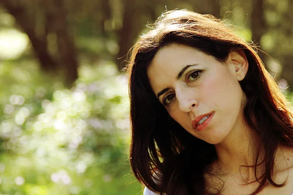 Portrait of beautiful 35 years old woman in summer forest — Stock Photo, Image