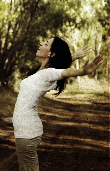 Beautiful 35 years old woman in spring forest. Photo in old imag — Stock Photo, Image