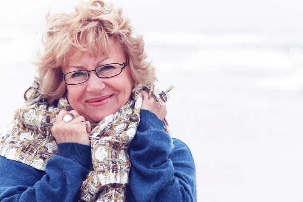 Portrait of happy senior woman at sea — Stock Photo, Image