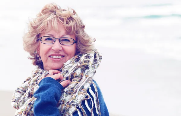 Portrait of happy senior woman at sea — Stock Photo, Image