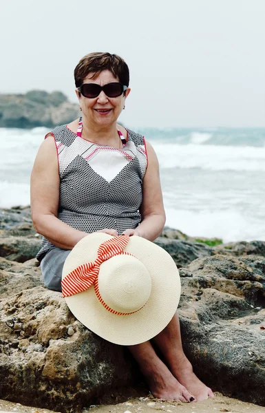 Senior woman on summer vacation at sea — Stock Photo, Image