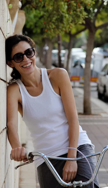 Laughing woman on an old bike — Stock Photo, Image