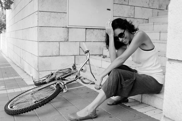 Woman with bicycle — Stock Photo, Image