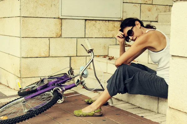 Woman with bicycle — Stock Photo, Image