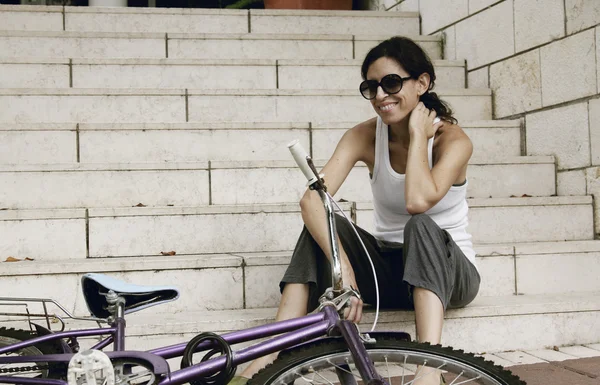 Woman with bicycle — Stock Photo, Image