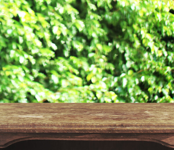 Vintage wooden table with natural heart bokeh background