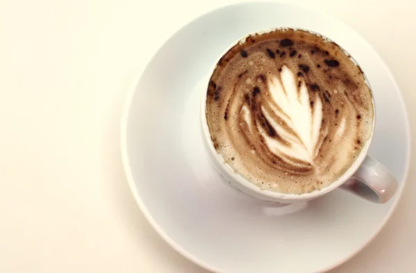 Kopje koffie op pastel kleuren — Stockfoto