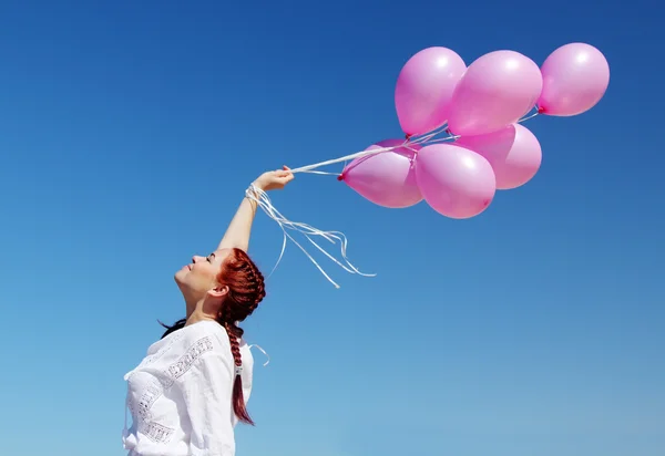 Kvinna med ballonger — Stockfoto