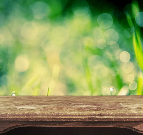 Vintage wooden table with natural bokeh background — Stock Photo, Image