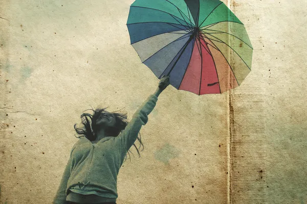 Woman with umbrella. Photo in old color image style. — Stock Photo, Image