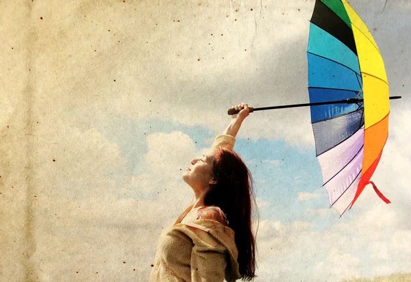 Woman with umbrella. Photo in old color image style. — Stock Photo, Image