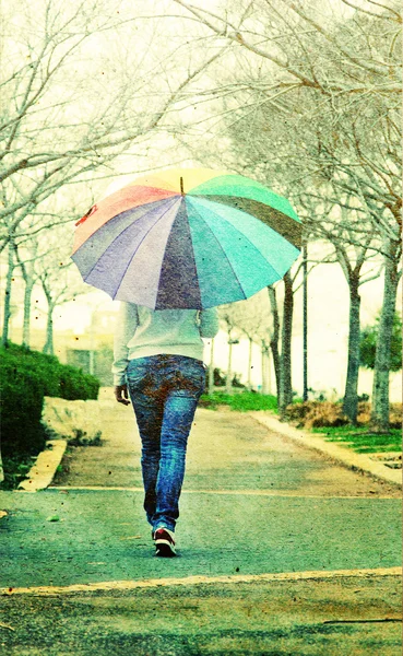 Woman with umbrella. Photo in old image style. — Stock Photo, Image