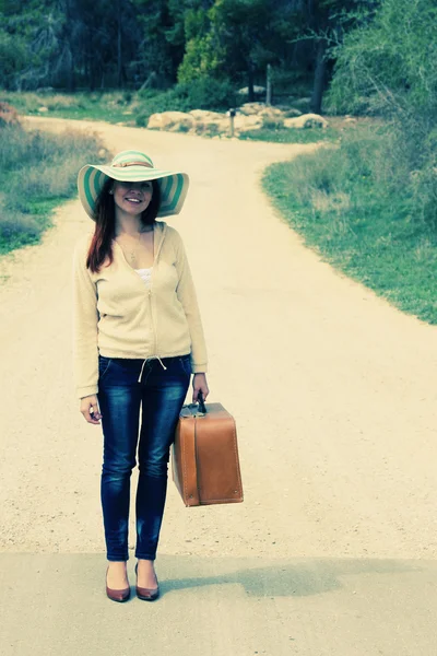 Woman with old vintage bag. Photo in old color image style. — Stock Photo, Image