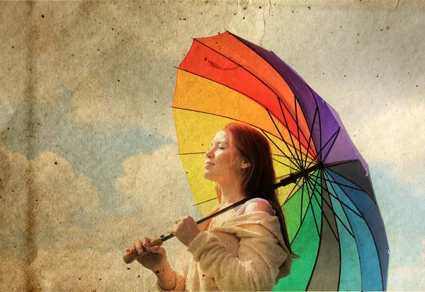 Woman with umbrella. Photo in old color image style. — Stock Photo, Image