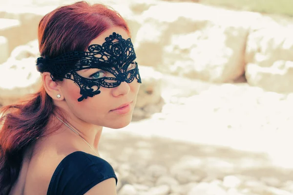 Portrait of beautiful woman in mask outdoors — Stock Photo, Image