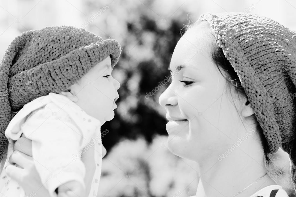 Portrait of happy loving mother and her baby outdoors