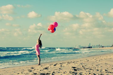 jonge redhead vrouw bedrijf ballonnen