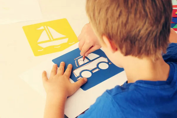 6 years old boy drawing — Stock Photo, Image