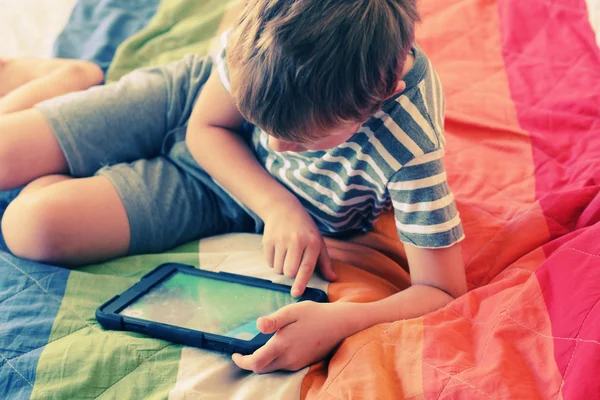 Cute boy using laptop — Stock Photo, Image