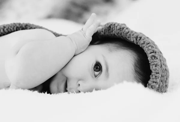 Adorable baby lying on coach — Stock Photo, Image