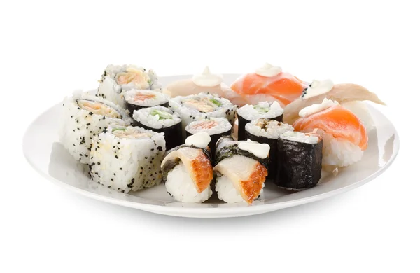 Sushi e rotoli in piatti — Foto Stock