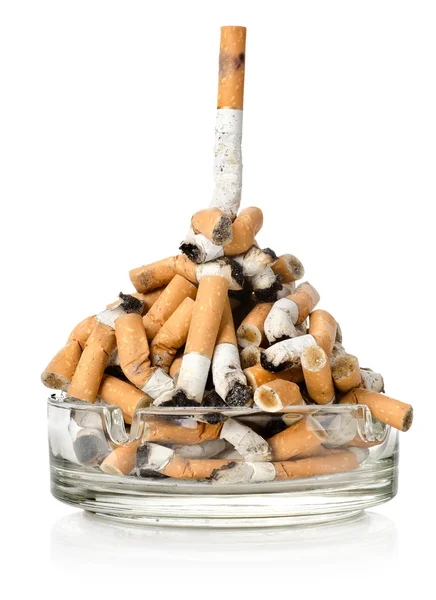 Cigarettes in a glass ashtray — Stock Photo, Image