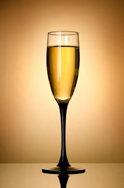 Wineglass over gold background — Stock Photo, Image