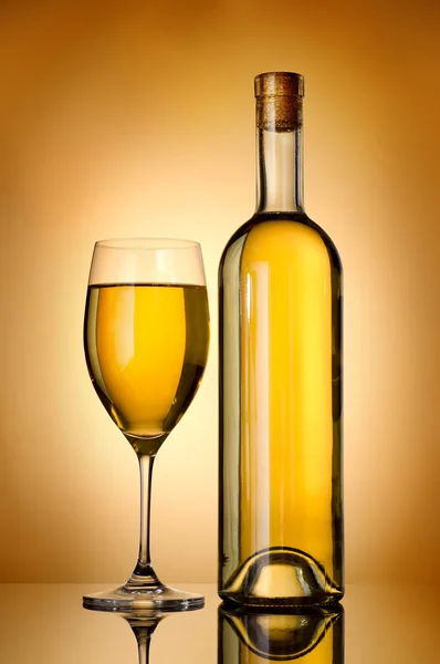 Bottle over gold background — Stock Photo, Image