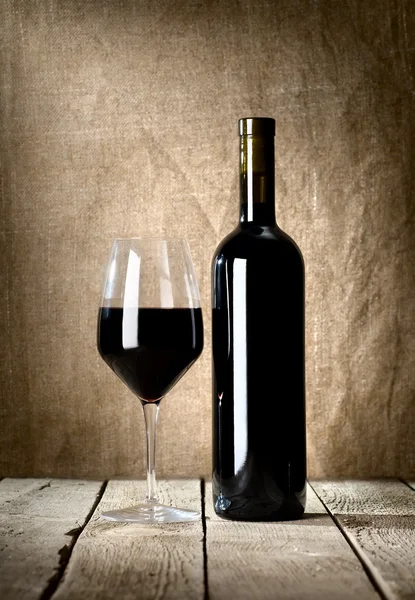 Black bottle and glass — Stock Photo, Image