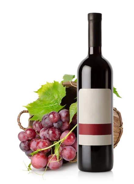 Wine bottle and grape in basket — Stock Photo, Image