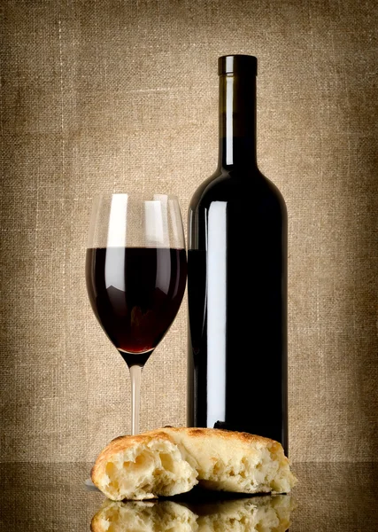 Wine and bread on canvas — Stock Photo, Image