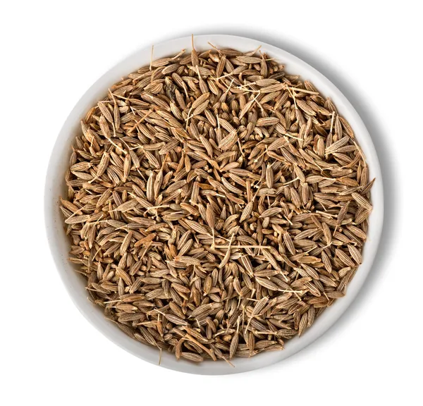 Cumin in plate isolated — Stock Photo, Image