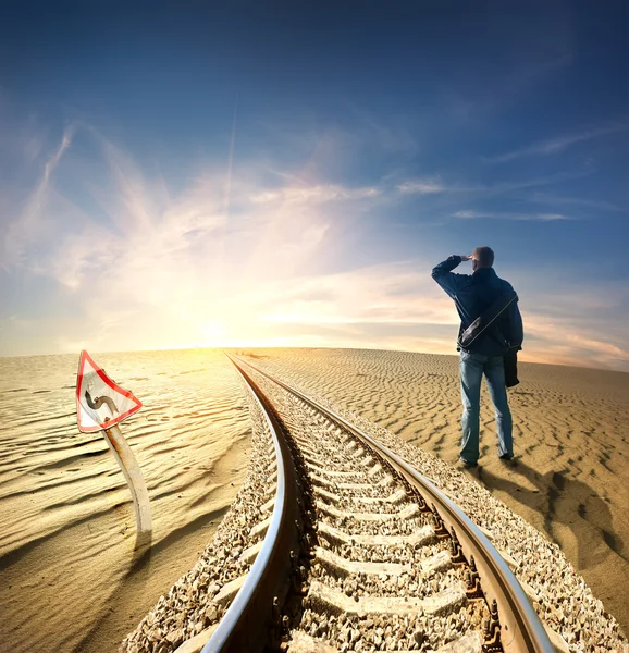 Man and railway in desert — Stock Photo, Image