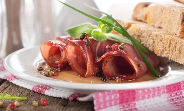 Bacon rolls in a white plate — Stock Photo, Image