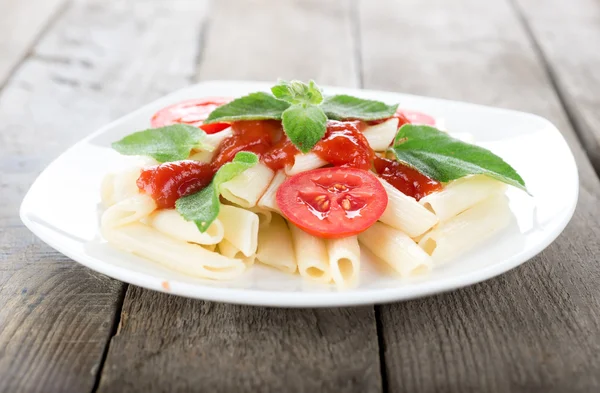 Pasta on a wooden table — Stock Photo, Image