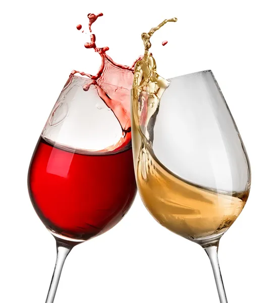 Spatten van wijn in twee wijnglazen Rechtenvrije Stockafbeeldingen