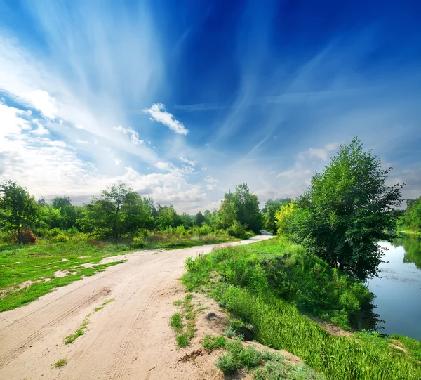 Country road and river — Stock Photo, Image