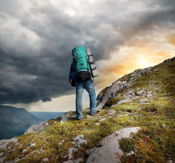 Backpacker in mountains — Stock Photo, Image