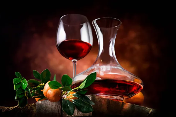 Tangerine wine on a wooden table — Stock Photo, Image