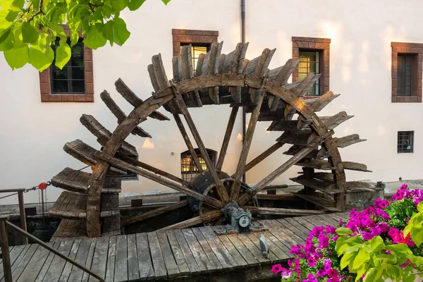 Wooden mill and flower — Stock Photo, Image