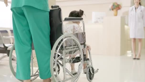 Health Medical Center Female Pediatrician Doctor Kid Patient Undergoing Wheelchair — Stock Video