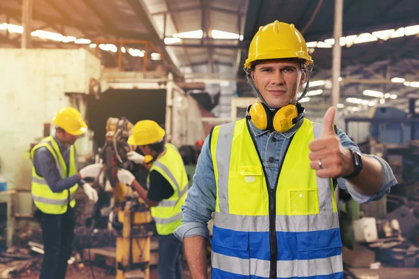 Portrait Bearded Factory Worker Hardhat Staring Photo While Standing Workshop — Stock Photo, Image