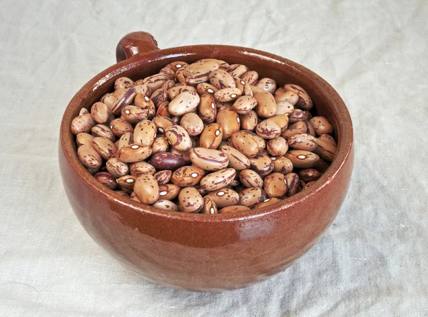 Pinto beans in ceramic mug
