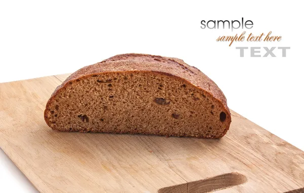 Brood op een snijplank — Stockfoto
