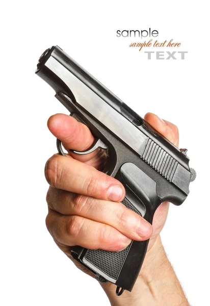 Man with a black gun in his hand — Stock Photo, Image