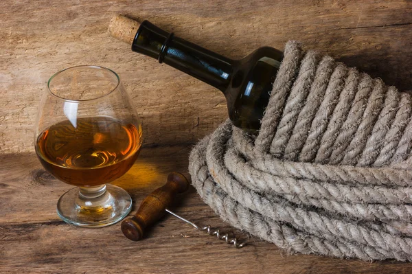 Bottle of wine wrapped with rope Stock Picture