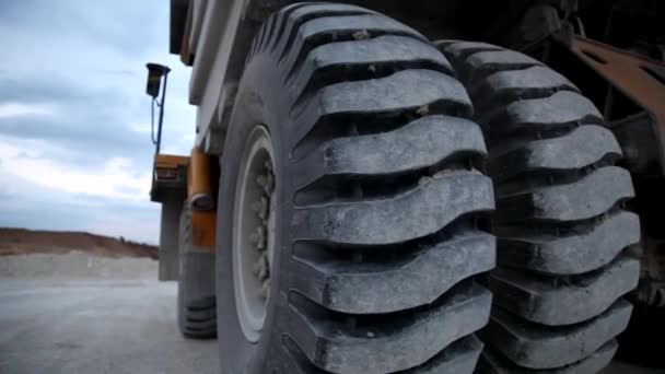 Heavy mining dump truck being loaded with iron ore — Stock Video