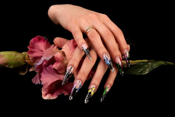 Human fingers with long fingernail and beautiful manicure isolated on black — Stock Photo, Image